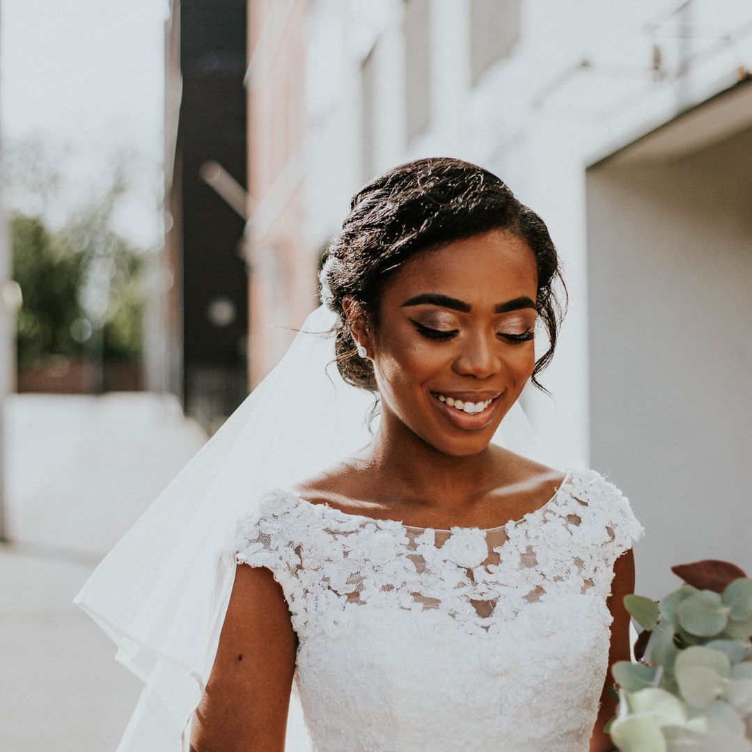 Premium Photo | A happy young bride with a wedding hairstyle in a white  lace dress runs through the courtyard of an ancient church.